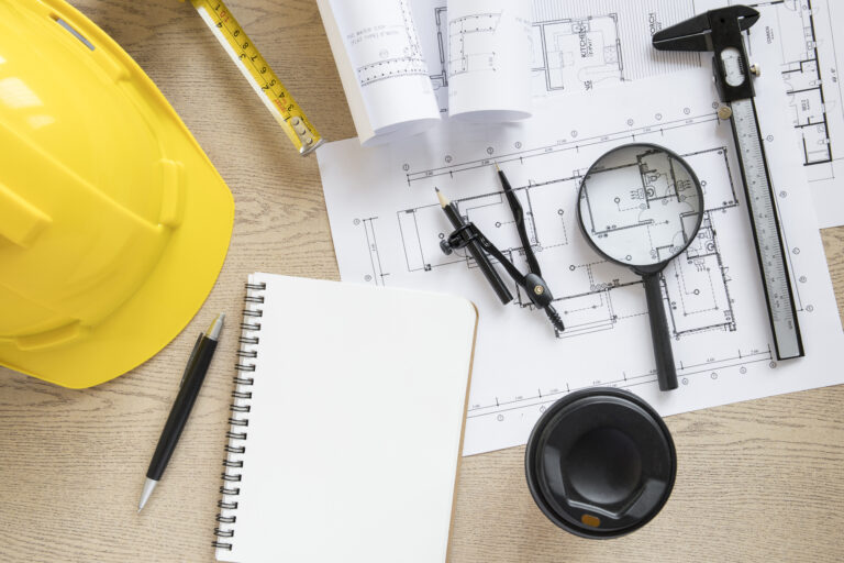 Planificación para construcción: Claves para un Proyecto Exitoso 8 taza y cuaderno cerca de suministros de construccion